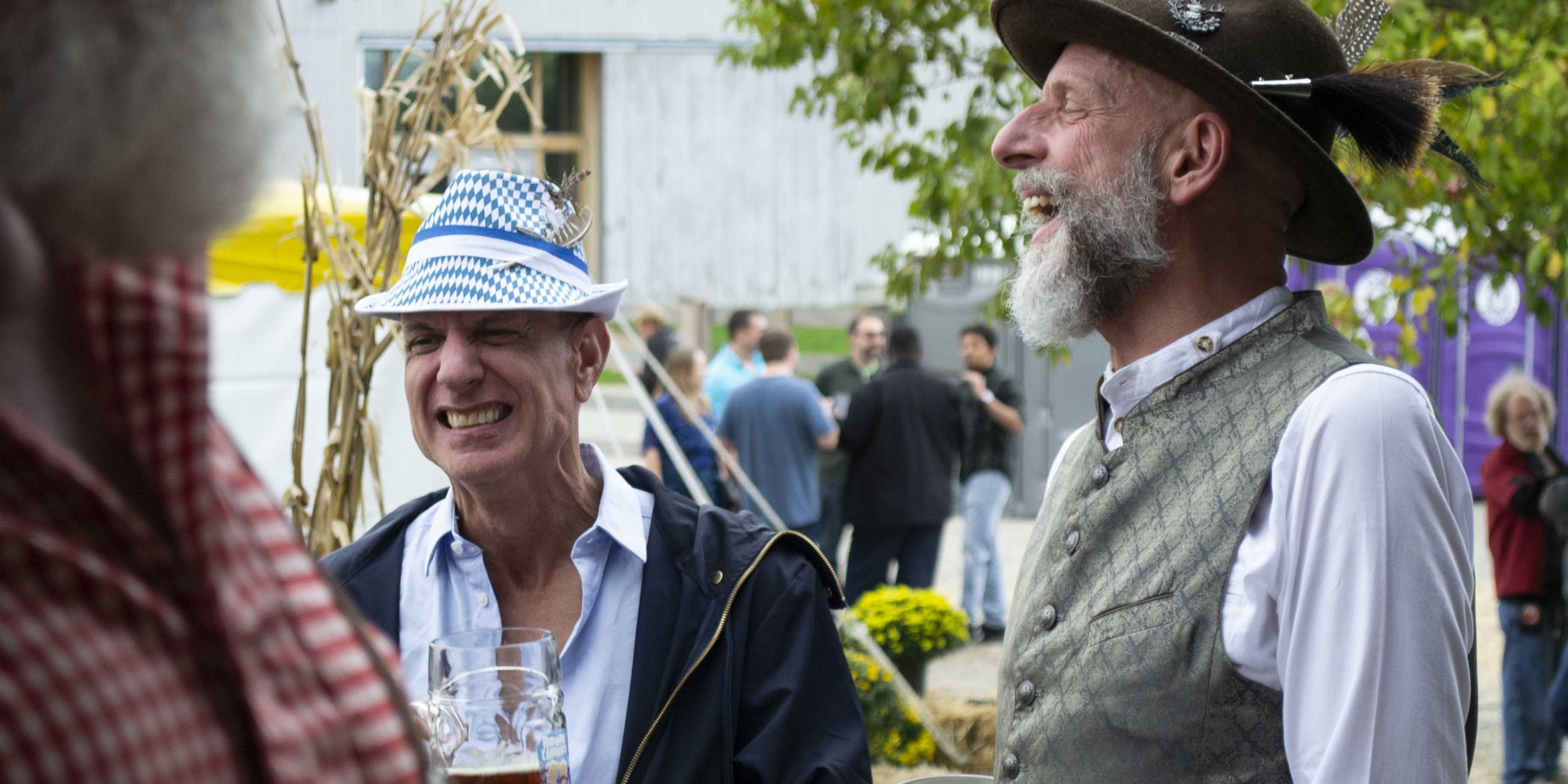 Oktoberfest Attendees enjoying a stein of beer