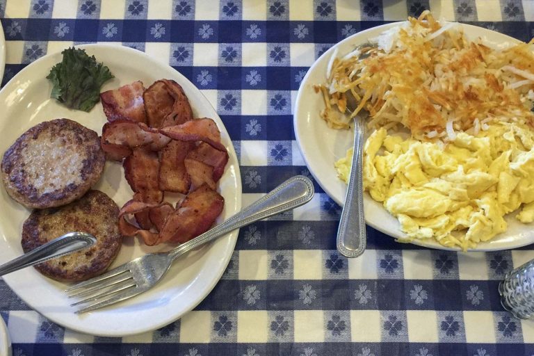Plates of delicious breakfast foods