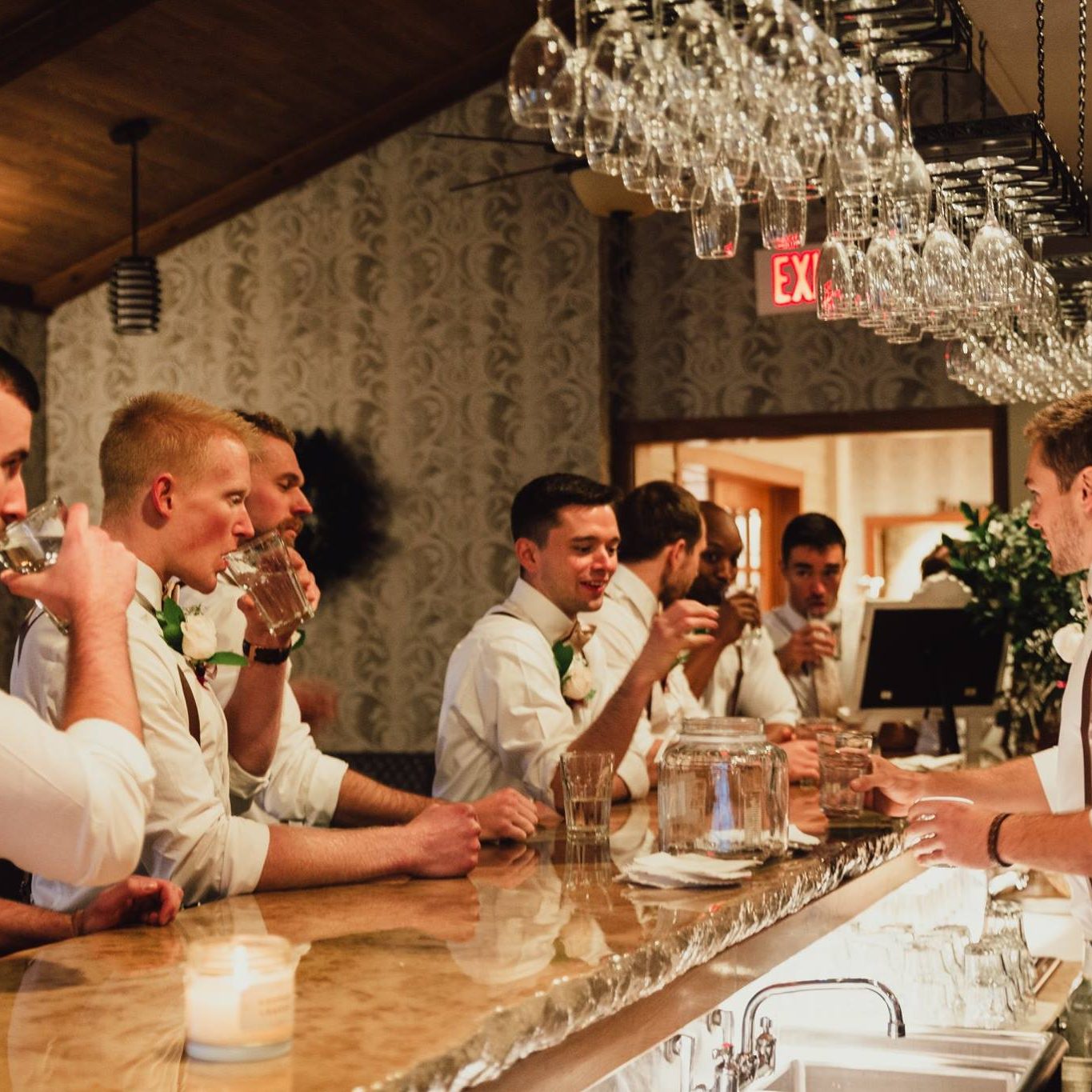Groomsmen at the bar at Amana Colonies