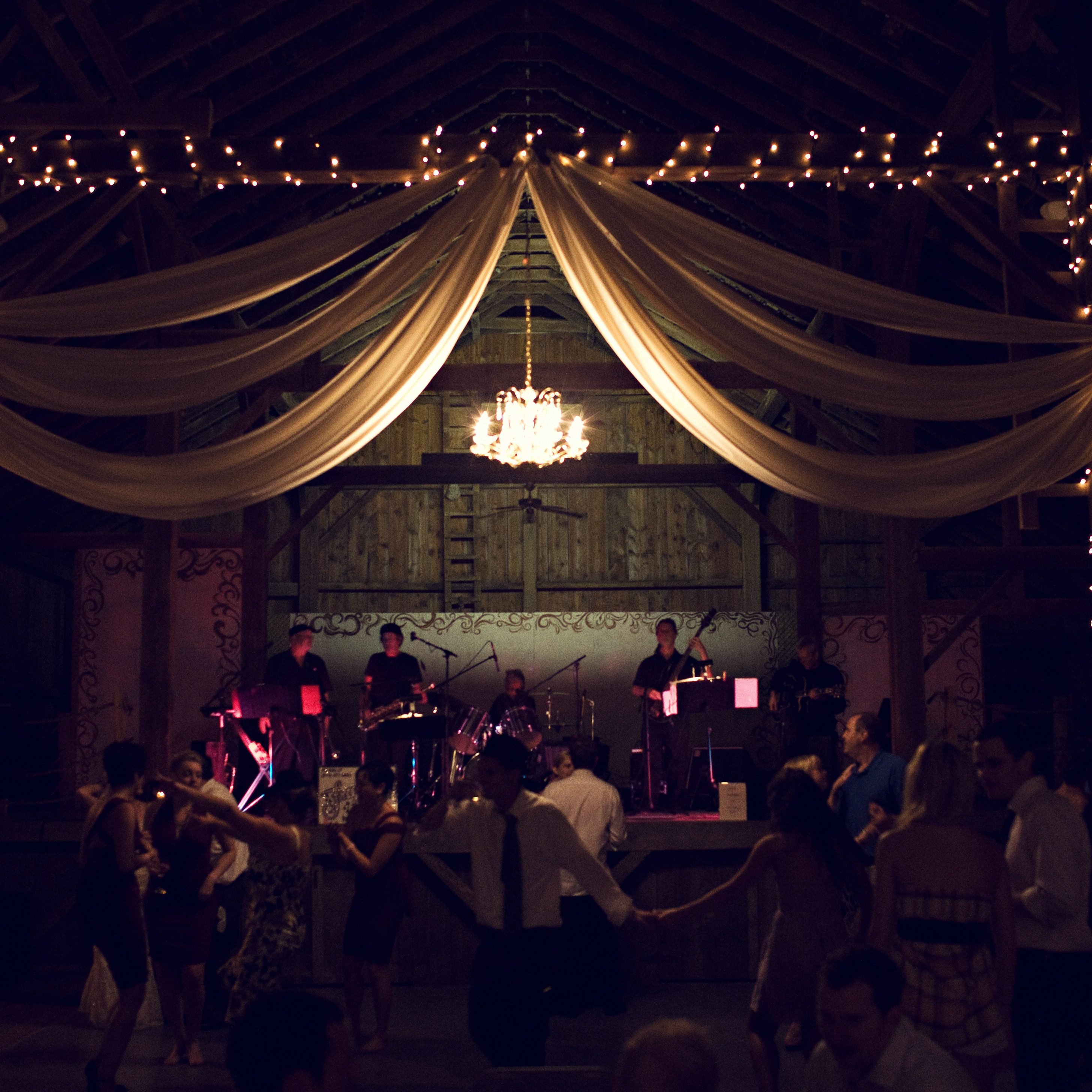 Band on stage at Laura & Adam Engel Wedding in Amana Colonies
