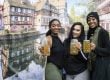 Friends enjoying a glass stein of beer at Oktoberfest in Amana Colonies, Iowa