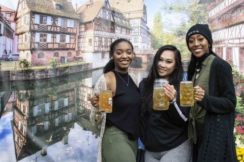 Friends enjoying a glass stein of beer at Oktoberfest in Amana Colonies, Iowa