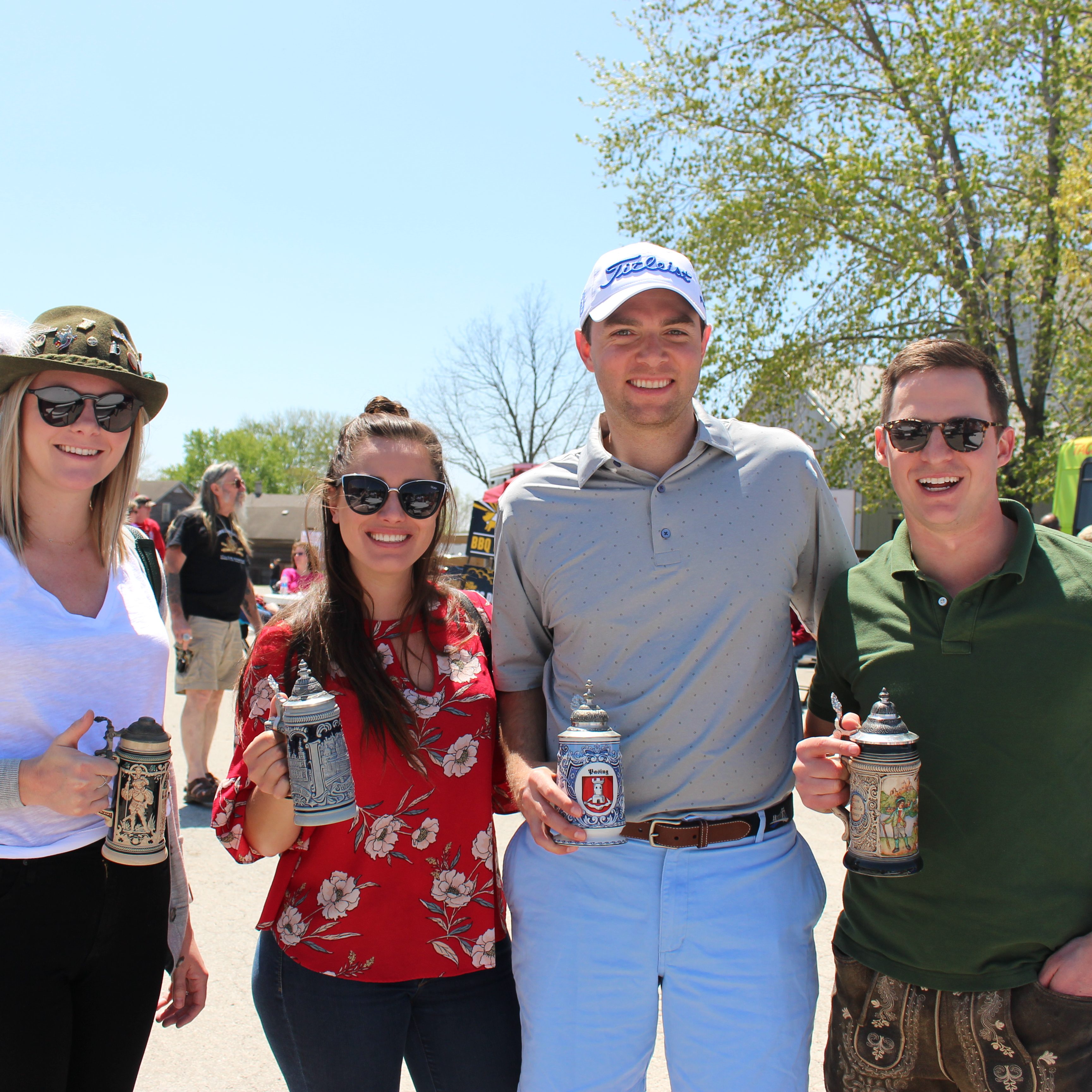 Maifest attendees enjoying a stein of beer in the Amana Colonies